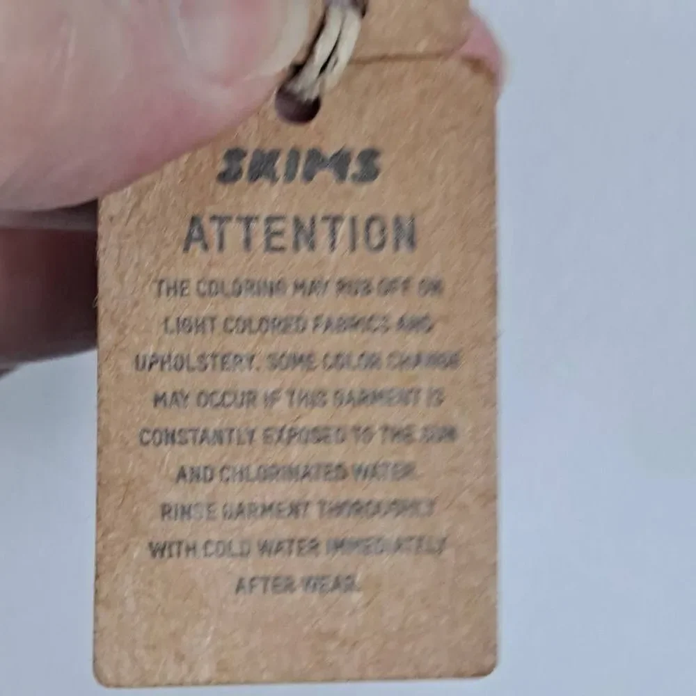SKIMS Swim mock neck cycle suit. NWT‎